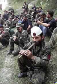 NATO chief due in Macedonia as Albanian Fighters Handover Weapons